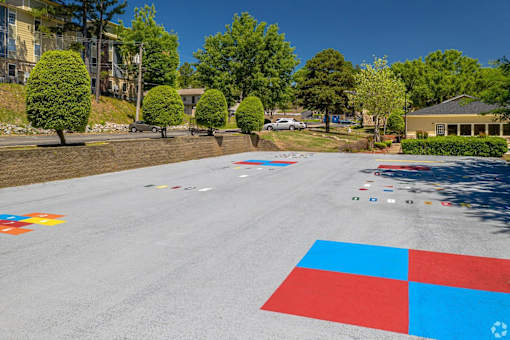 A road with a red, white and blue square painted on it.