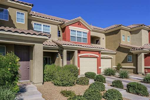 A row of houses with brown and tan exteriors.