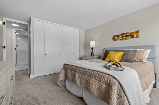a bedroom with a bed and a dresser