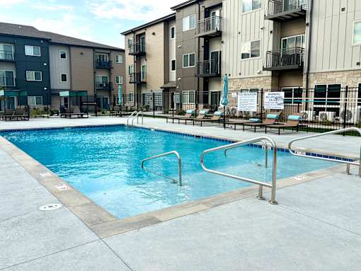 a swimming pool in the middle of an apartment building