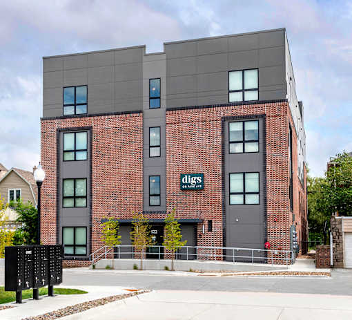 a brick building with a sign on the side of it