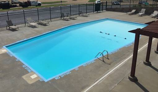 A view of the swimming pool at Cedar Ridge Apartments.