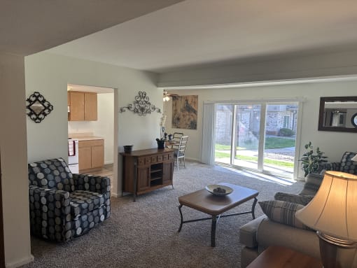A cozy living room in the Park 25 Apartments model unit, with comfortable seating and inviting decor.
