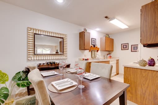 Regency Woods Model Unit - Dining Dining room in a Regency Woods model unit with a wooden table set for four.