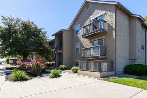 Exterior view of the Southfork Apartments clubhouse with a well-kept lawn.