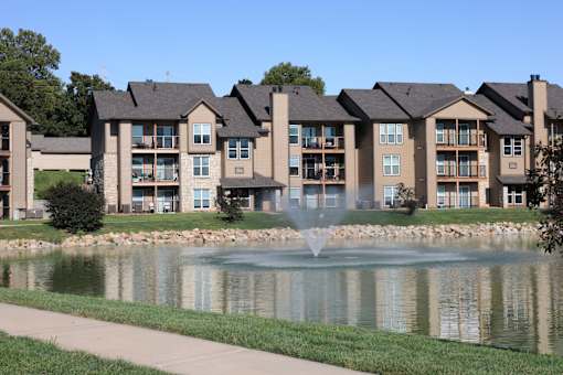 Three Lakes community building with a fountain in front, creating a welcoming entrance and gathering space.