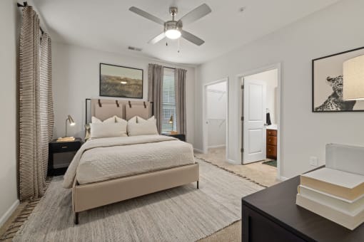 a bedroom with a bed and a ceiling fan