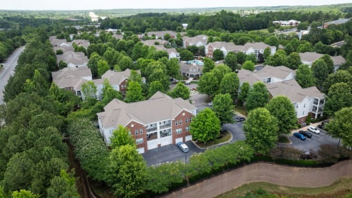 an aerial view of a neighborhood with trees and buildings