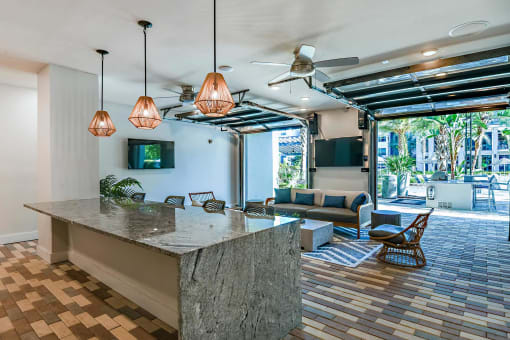 the lobby or reception area of a hotel with a reception counter