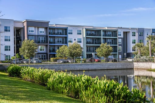 an apartment building overlooking a body of water