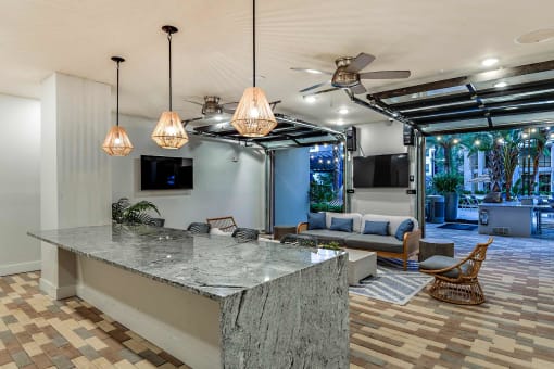 a kitchen with a counter top and a living room