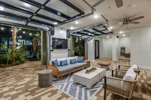 a living room with a couch and a tv