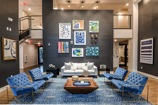 Club House Seating Area with Blue Couches and Wall Art