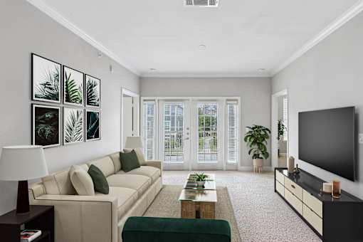 A living room with a couch, a coffee table, a lamp, and a television.