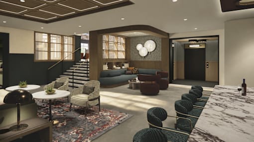 A modern living room with a variety of seating options and a large window.