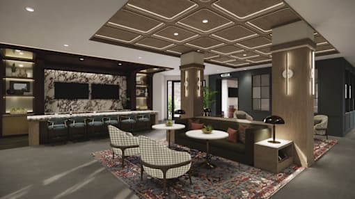 A modern living room with a fireplace and a variety of seating options.