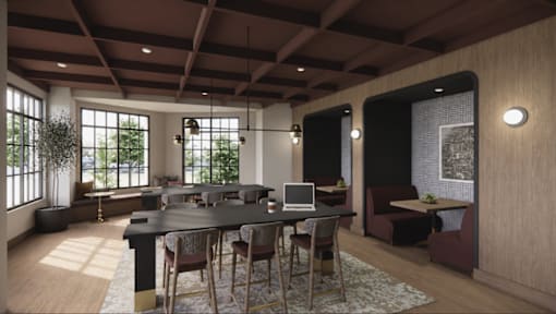 A modern dining room with a large table and chairs.