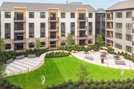 an aerial view of an apartment building with a lawn and garden at Stonehill at West Orange, New Jersey, 07052