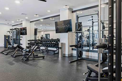 Fitness center with free weights and equipment at The Piermont Apartments, Hillsdale, NJ