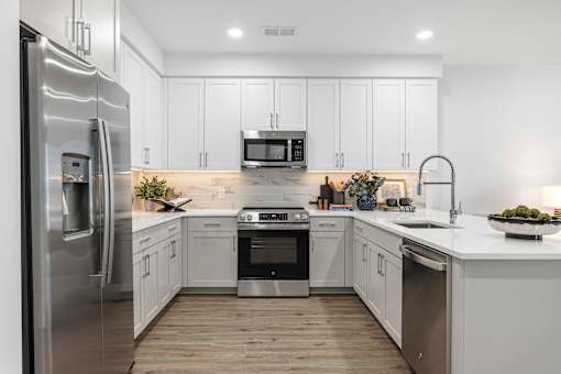 Modern kitchen with stainless steel appliances at The Piermont Apartments, Hillsdale, NJ 07642