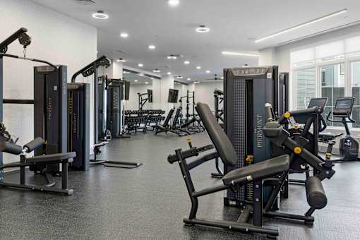 Strength training room with cable machines at The Piermont Apartments, New Jersey