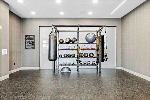 Fitness equipment storage with weights and punching bag at The Piermont Apartments, Hillsdale, 07642