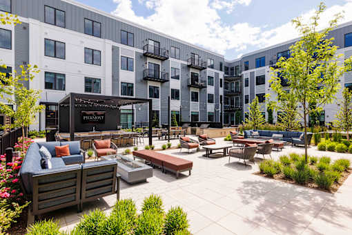 Outdoor courtyard with lounge seating and landscaping at The Piermont Apartments, Hillsdale