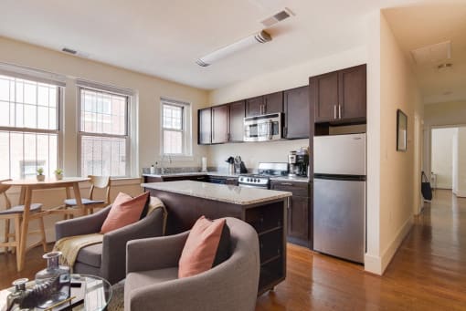 a kitchen and living room at 1841 Columbia Road Apartments, Washington, 20009