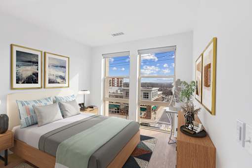 A bedroom with a large bed and a view of the city.