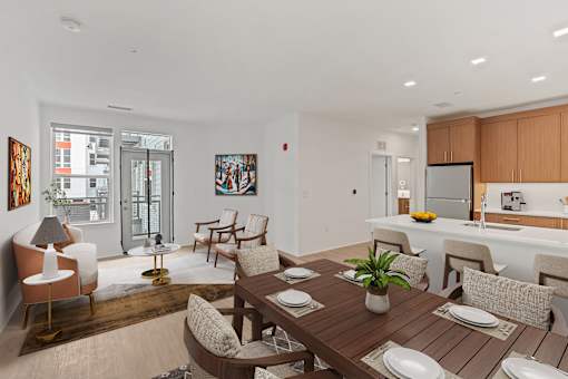 A modern dining room with a wooden table and chairs.