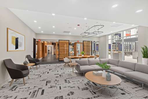 A modern office lobby with a black and white patterned carpet.