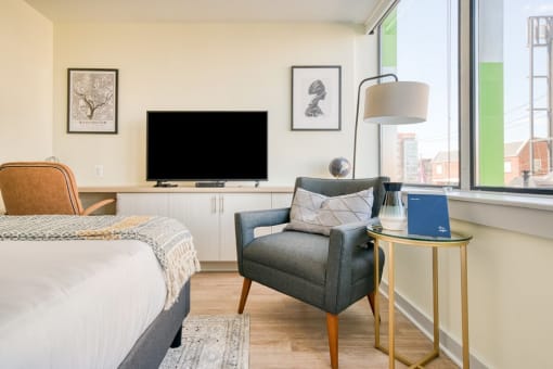 a bedroom with a bed and a window