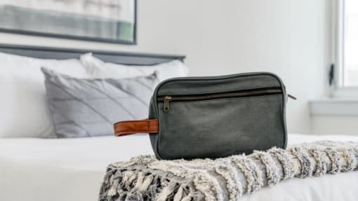a bag sitting on top of a bed