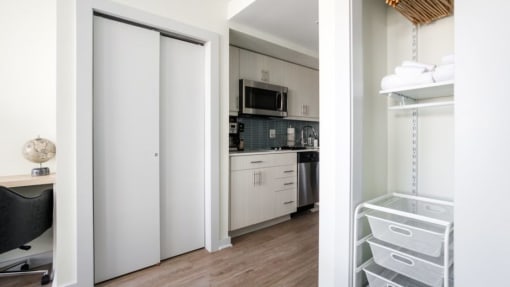 a kitchen with a refrigerator freezer next to a stove top oven