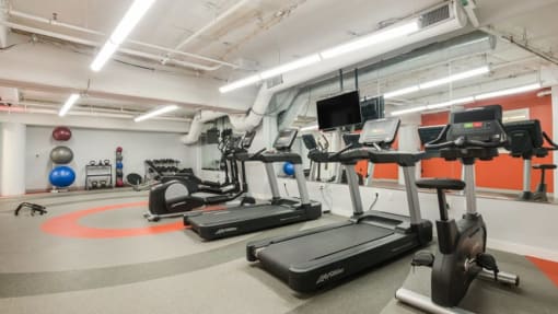 a room filled with lots of exercise equipment