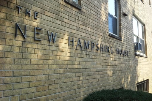a brick wall with the name of the new haven trust on it