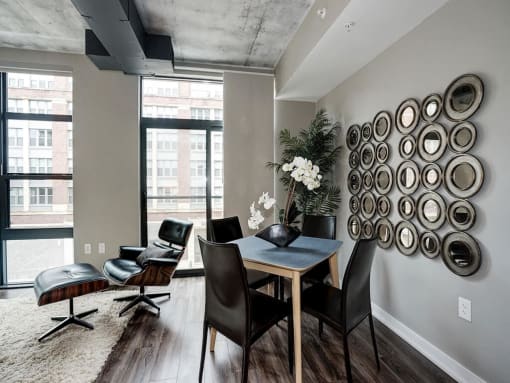 a view of a living room with a window and a table at Coda on H Apartments, District of Columbia 20002