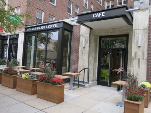 a view of the front of the cafe from the sidewalk at 1841 Columbia Road Apartments, Washington, Washington DC
