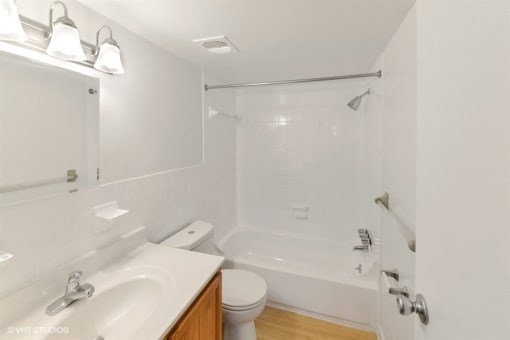 Large Soaking Tub In Primary Bathroom with A Tile Surround at The Forest, Rockville