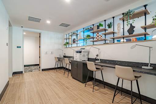 Coffee bar with counter seating and open shelving at The Yancey Apartments, Charlotte, NC 28217