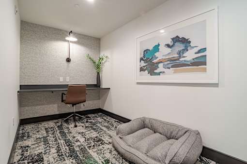 Small office space with floating desk and dog bed at The Yancey Apartments, North Carolina