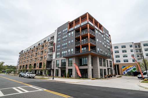 Modern apartment building exterior with corner balconies at The Yancey Apartments, Charlotte, NC 28217