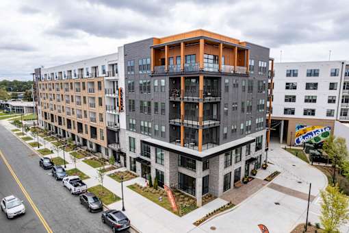 Modern apartment building exterior with street view at The Yancey Apartments, Charlotte, 28217
