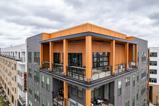 Rooftop amenity deck with covered pavilion and skyline views at The Yancey Apartments, Charlotte, NC