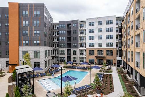 Courtyard pool area surrounded by modern apartment buildings at The Yancey Apartments, Charlotte, North Carolina