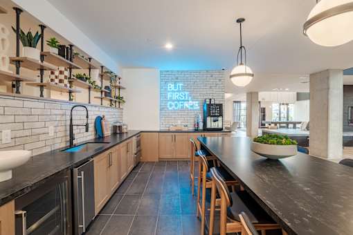 Coffee bar with subway tile and wood shelving at The Yancey Apartments, Charlotte