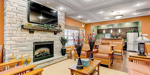 Living Room with Stone Fireplace at The Villages at Belle Hill, Maryland