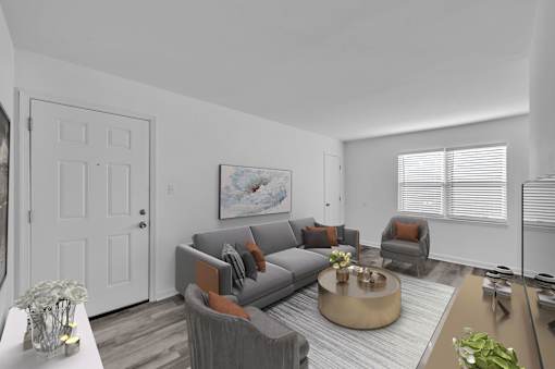 A living room with a grey couch and a coffee table.