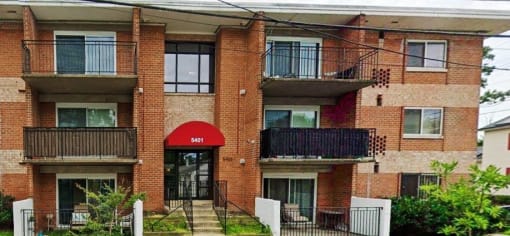 a building with a red awning in front of it