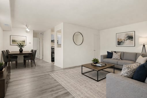 A living room with a grey couch and a coffee table.